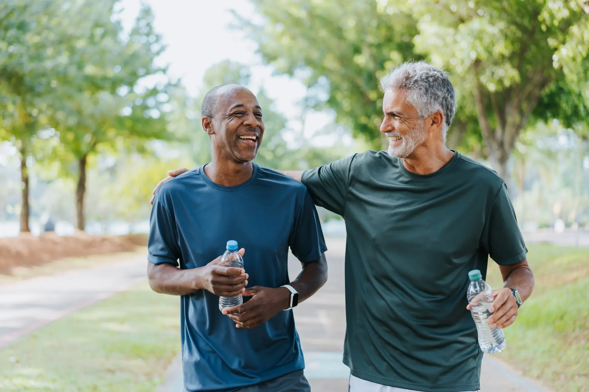 Senior friends walking in public park